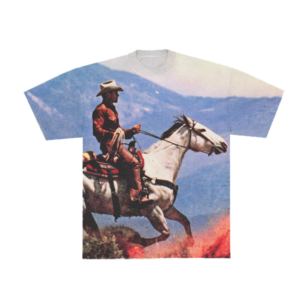 Front of a T-shirt with Cowboy on a horse with a mountainous background 